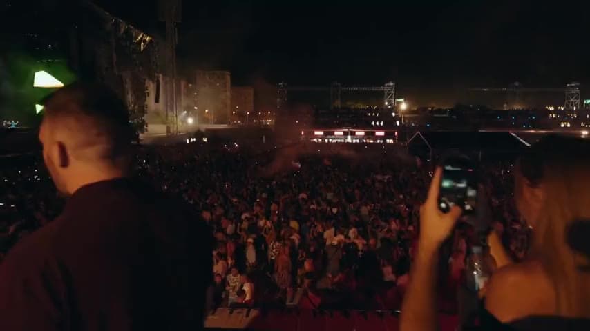Crowd at Ultra Europe festival in Split at night with colourful stage lighting